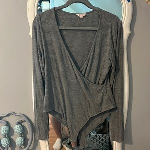 grey cross over body suit